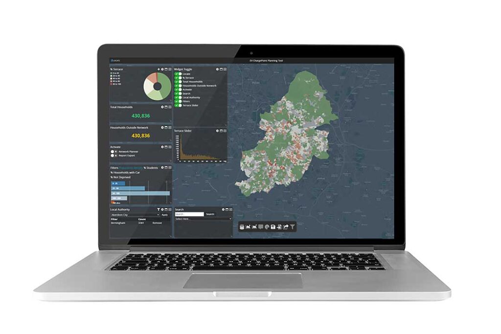 A laptop displaying a geospatial dashboard for EV charge point planning, featuring a detailed map and various data visualisation widgets, including pie charts, bar graphs, and filters, highlighting infrastructure analysis and insights.